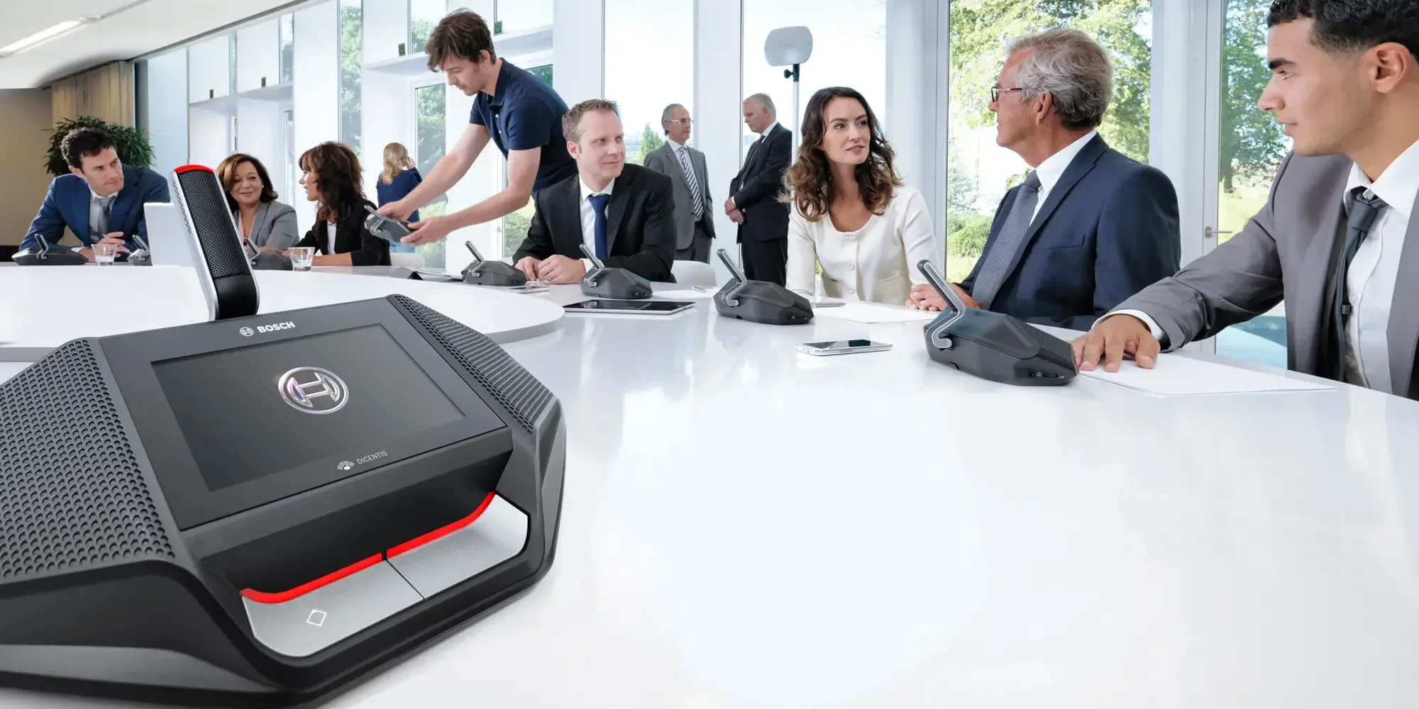 Bosch DICENTIS Wireless DCNM-WDE discussion device on a meeting table with delegates